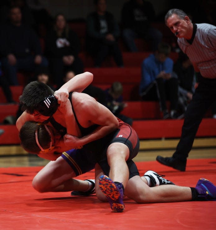 Roland-Story's Anthony Jones takes down Nevada's Simon Mills on his way to scoring a fall at 160 pounds during the a 42-24 Norsemen victory over the Cubs in a double-dual with the two teams and Boone Jan. 12 at Story City.