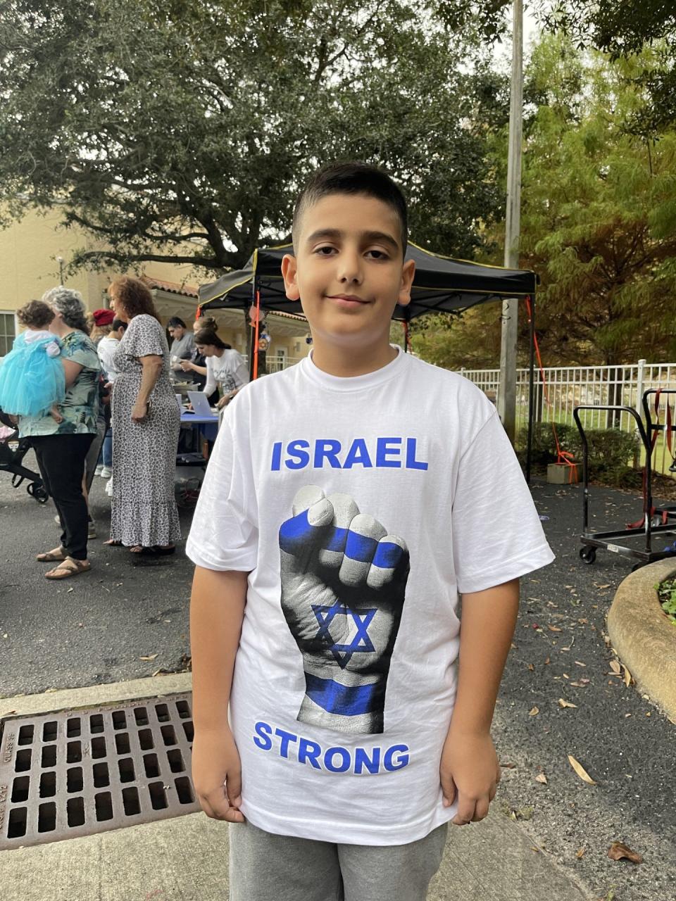 Jonathan Chen, 8, and his mother, Shani Chen, arrived in Ormond Beach a month ago from Rishon Le Zion, Israel. On Sunday, he showed support for his country at a celebration of Hanukkah at the Chabad Lubavitch of Greater Daytona Beach.