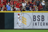 Cincinnati Reds' Shogo Akiyama makes a leaping catch at the outfield wall during the seventh inning of the team's baseball game against the St. Louis Cardinals in Cincinnati, Saturday, July 24, 2021. (AP Photo/Aaron Doster)