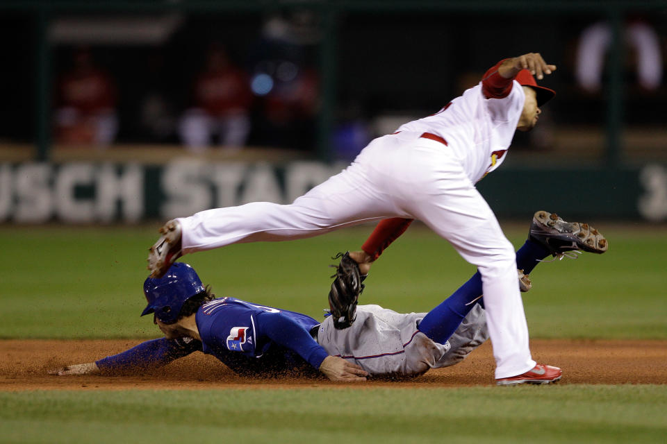 ST LOUIS, MO - OCTOBER 19: Ian Kinsler #5 of the Texas Rangers is caught stealing at second base by Rafael Furcal #15 of the St. Louis Cardinals during Game One of the MLB World Series at Busch Stadium on October 19, 2011 in St Louis, Missouri. (Photo by Rob Carr/Getty Images)