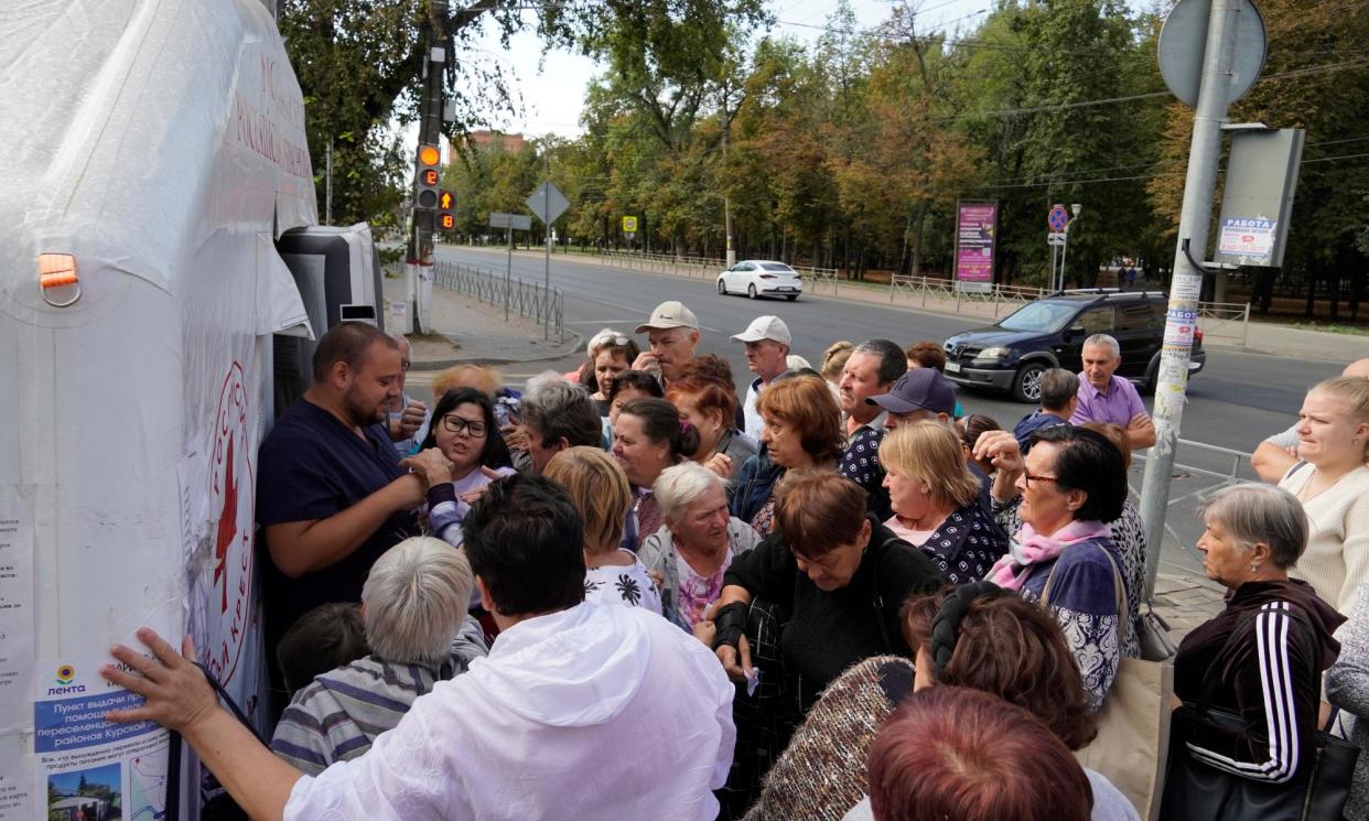 <span>Evacuated civilians waiting for humanitarian aid in Kursk region this week.</span><span>Photograph: EPA</span>