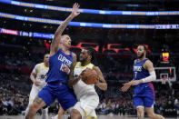 Utah Jazz forward Brice Sensabaugh (8) drives against Los Angeles Clippers center Daniel Theis (10) as Jazz guard Keyonte George (L) and Clippers guard Amir Coffey (7) watch during the second half of an NBA basketball game in Los Angeles, Friday, April 12, 2024. (AP Photo/Eric Thayer)