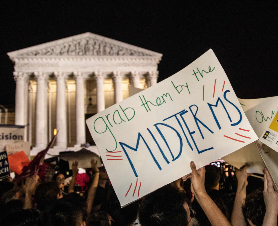 <p>”Grab them by the midterms” reads the sign. Hundreds assembled in front of the U.S. Supreme Court in Washington D.C., to protest Brett Kavanaugh, President Donald Trump’s nominee to replace Justice Anthony Kennedy, on Monday night, July 9, 2018. (Photo: Jeff Malet/Newscom via ZUMA Press) </p>