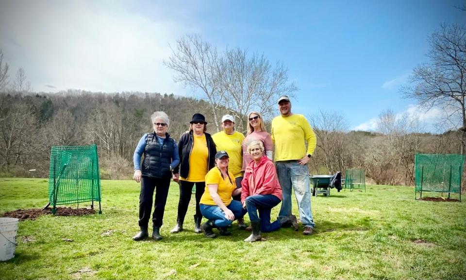 Honesdale Rotary Club planted a dozen apple trees on April 14, 2024, at Apple Grove Park in Honesdale to replace older apple trees that were cut down out of safety concerns. From left, standing are Sue Miele, Michelle Gilder, Dana Scott, Melody Robinson and James Hamill. In front are Andrea Chapman and Bonny Cousins. All are Rotary members, except Robinson.