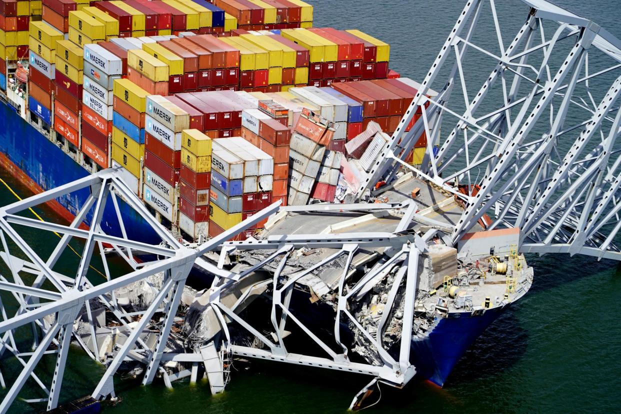 <span>The Dali stuck under the Francis Scott Key bridge in Baltimore, Maryland, in March.</span><span>Photograph: Maryland National Guard via AP</span>