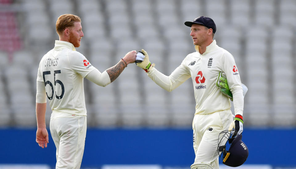 Jos Buttler (pictured right) and Ben Stokes (pictured left) fist-bump during a Test match.