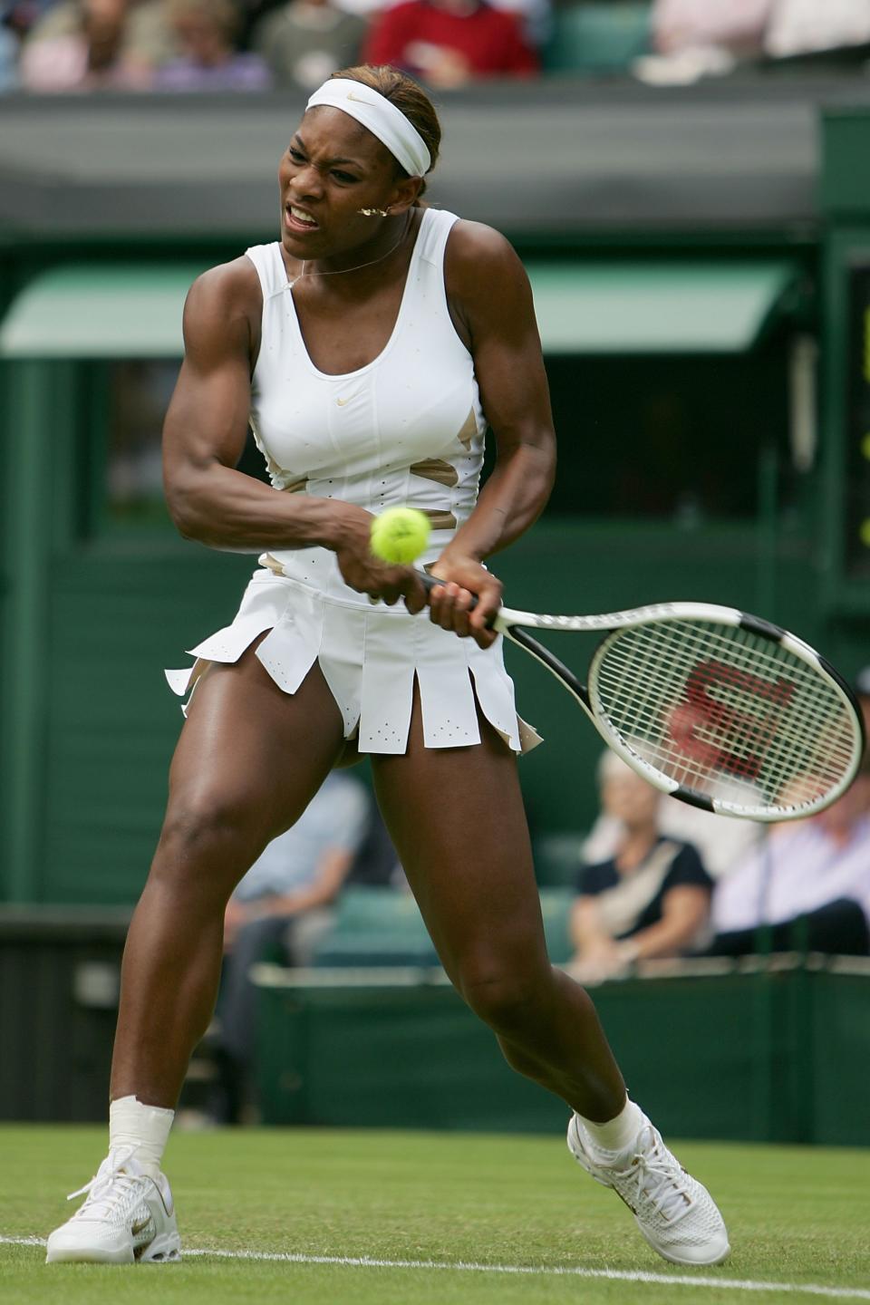 serena williams wimbledon fashion outfits and looks, LONDON - JUNE 22: Serena Williams of USA in action during her first round match against Jie Zheng of China at the Wimbledon Lawn Tennis Championship on June 22, 2004 at the All England Lawn Tennis and Croquet Club in London. (Photo by Clive Brunskill/Getty Images)