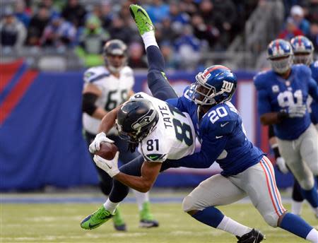 East Rutherford, NJ, USA; Seattle Seahawks wide receiver Golden Tate (81) is tackled by New York Giants cornerback Prince Amukamara (20) in the first half during the game at MetLife Stadium. Robert Deutsch-USA TODAY Sports