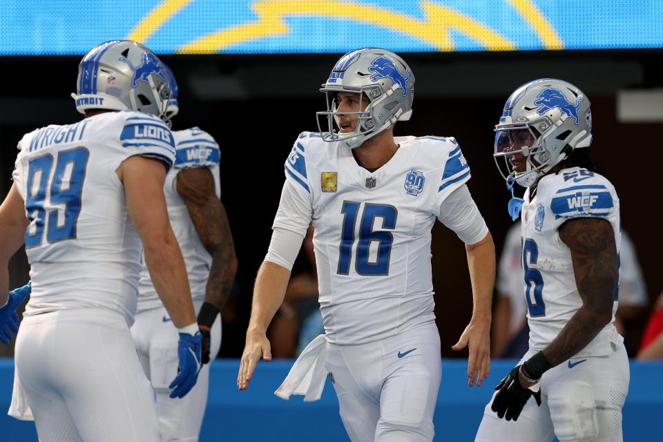 Jared Goff of the Detroit Lions celebrates a run with Jahmyr Gibbs of the Detroit Lions during the first quarter against the Los Angeles Chargers at SoFi Stadium on November 12, 2023 in Inglewood, California.
