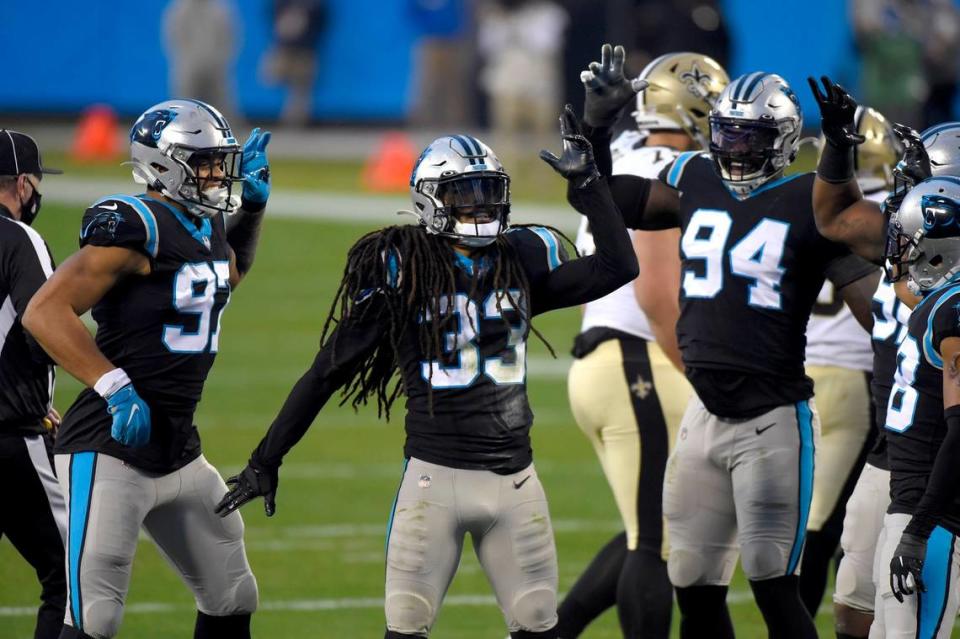 Carolina Panthers safety Tre Boston, center, celebrates his sack of New Orleans Saints quarterback Drew Brees during first half action at Bank of America Stadium on Sunday, January 3, 2021.