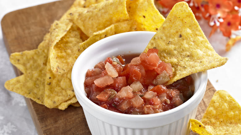 Tortilla chip dipped in salsa