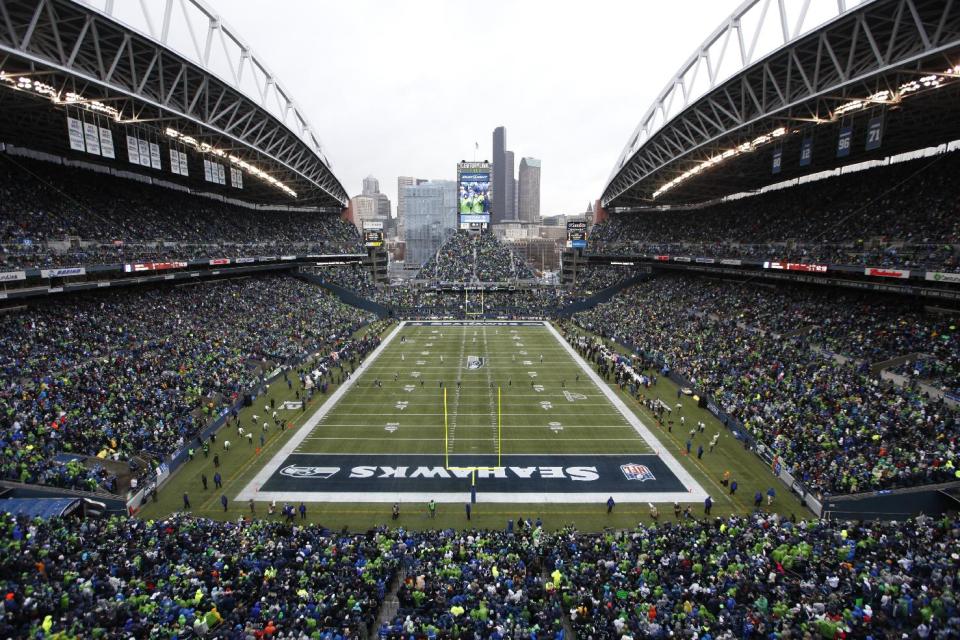 FILE - In this Jan. 11, 2014 file photo, fans at CenturyLink Field watch during the first quarter of an NFC divisional playoff NFL football game between the Seattle Seahawks and the New Orleans Saints in Seattle. Fox Sports will use this weekend's NFC title game in Seattle between the San Francisco 49ers and the Seahawks to test an infrared camera that will show how players' body temperatures change throughout the game. (AP Photo/John Froschauer, File)