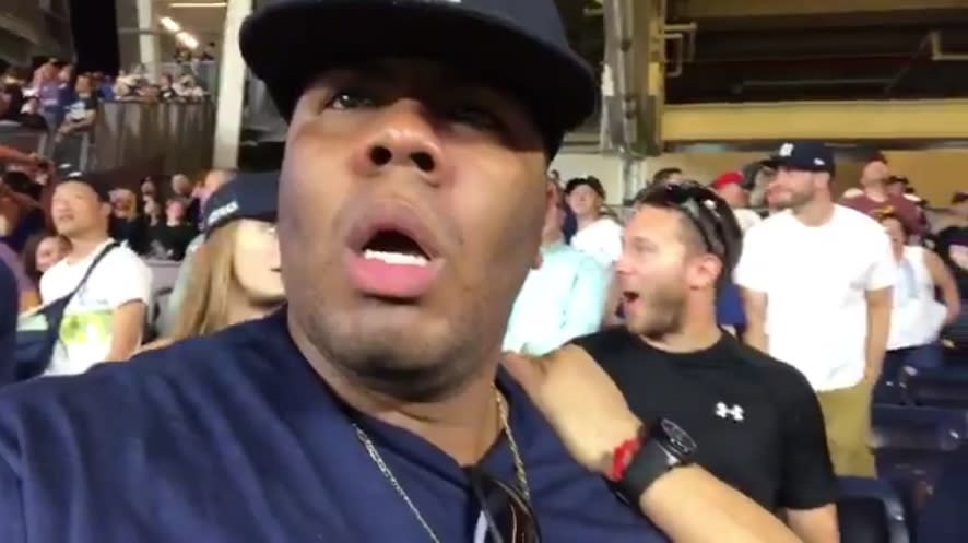 A Yankees fan watches in disbelief as Aroldis Chapman gives up a game-tying home run to Red Sox rookie Rafael Devers. (Twitter/@JoezMcfLy)