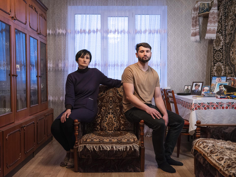 Svitlana Klymenko, 53, and her son Viacheslav, 31, wait for her husband at her apartment in Ivankiv, Kyiv region on Feb. 10, 2024. Oleh Klymenko, who worked as an emergency medical responder went missing on March 6, 2022 during the Russian occupation of Ivankiv. He vanished on his way home from work and since then his family have had no news of his whereabouts. "On the tenth day of the occupation, he went home to change clothes, to keep functioning normally, to continue working, but he didn't return to work. This happened in broad daylight," Viacheslav said. The war took the family's father but also a son Mykola, who was killed during the fighting against Russian forces in the besieged city of Mariupol in March 2022. (AP Photo/Evgeniy Maloletka)