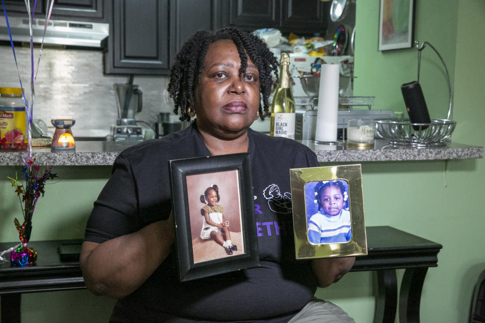 Joyce McMillan shows pictures of her children at her home in the Harlem neighborhood of New York City on Monday, May 15, 2023. The city's child protective services removed her two daughters from her custody 23 years ago after an investigation discovered an illicit substance in her body. McMillan is the founder of the advocacy group JMACforFamilies and is now an advocate pushing for reforms to the child welfare system. (AP Photo/Ted Shaffrey)