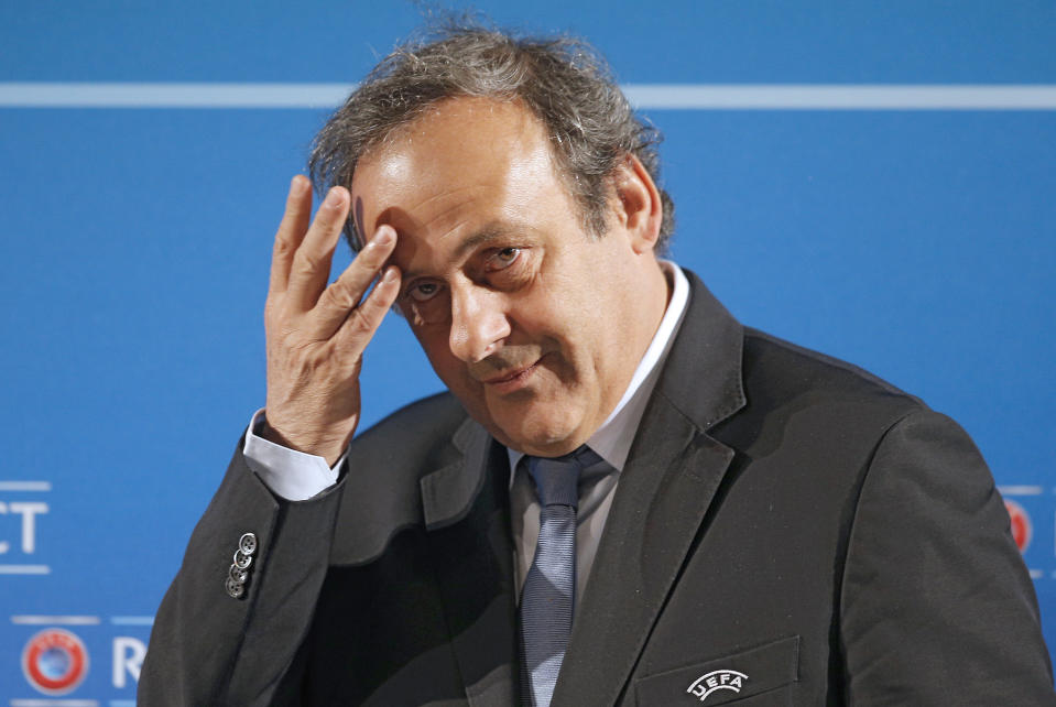 FILE - In this Feb.22, 2014 file photo, UEFA President Michel Platini arrives at a press conference, one day prior to the UEFA EURO 2016 qualifying draw in Nice, southeastern France. Former UEFA president Michel Platini has been arrested Tuesday June 18, 2019 over the awarding of the 2022 World Cup. (AP Photo/Lionel Cironneau, File)