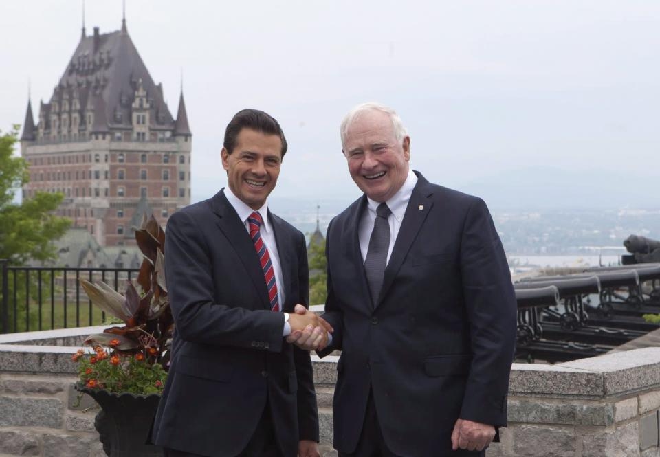 Mexico’s president Enrique Pena Nieto shakes hands with Canadian Governor General David Johnston, right, in Quebec City Monday, June 27, 2016. THE CANADIAN PRESS/Clement Allard