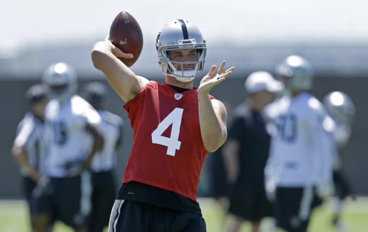 Derek Carr will remain with the Raiders after agreeing to an extension. (AP)