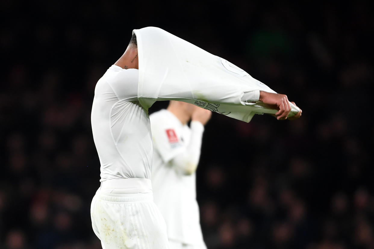 Arsenal defender Gabriel Magalhaes taking off his jersey after the team's defeat by Liverpool in the FA Cup third round at Emirates Stadium.