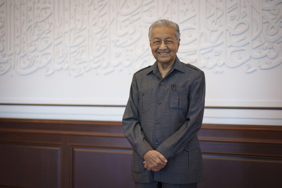 Malaysia's former Prime Minister Mahathir Mohamad poses for a picture during an interview with The Associated Press at his office in Kuala Lumpur, Malaysia, Friday, Aug. 19, 2022. Mahathir expects Malaysia’s graft-tainted ruling party will hold general elections in coming months, and could win big, but the nonagenarian reformer vowed Friday that he would fight "even a losing battle" on principle. (AP Photo/Vincent Thian)