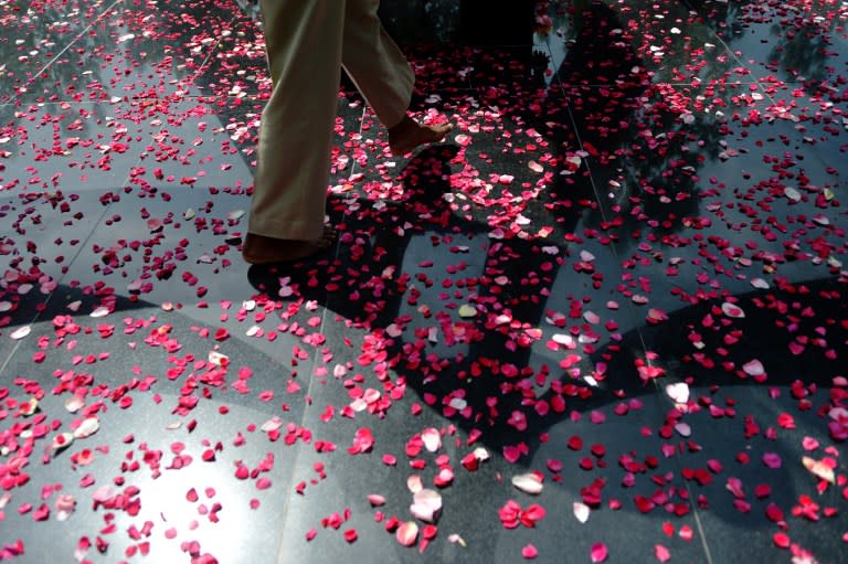 <p>An Indian Border Security Force soldier (BSF) walks over rose petals at a memorial for those killed in conflict following a wreath-laying ceremony for three colleagues at the BSF headquarters in Srinagar on June 4, 2016. Suspected militants ambushed a Border Security Force (BSF) vehicle in Bijbehara, south of Srinagar, on June 3, killing three soldiers and injuring three others. </p>