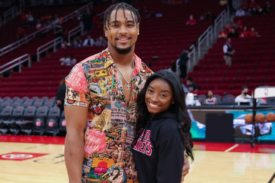 HOUSTON, TEXAS – DECEMBER 28: Simone Biles and Jonathan Owens attend a game between the Houston Rockets and the Los Angeles Lakers at Toyota Center on December 28, 2021 in Houston, Texas. NOTE TO USER: User expressly acknowledges and agrees that, by downloading and or using this photograph, User is consenting to the terms and conditions of the Getty Images License Agreement. (Photo by Carmen Mandato/Getty Images)