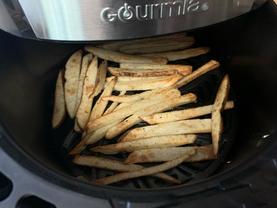 Cooked french fries in air fryer basket