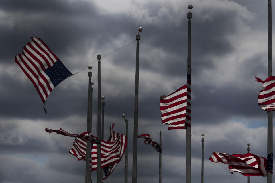 <p>Flags surrounding the Washington Monument whip in the high winds on March 2, 2018 in Washington, DC. (Photo: Carolyn Van Houten/The Washington Post via Getty Images) </p>