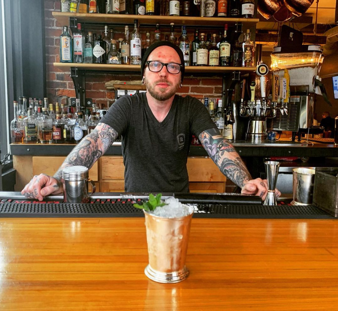 Bartender Phil Knoche presents his version of the mint julep at Rich's Proper, in Covington.