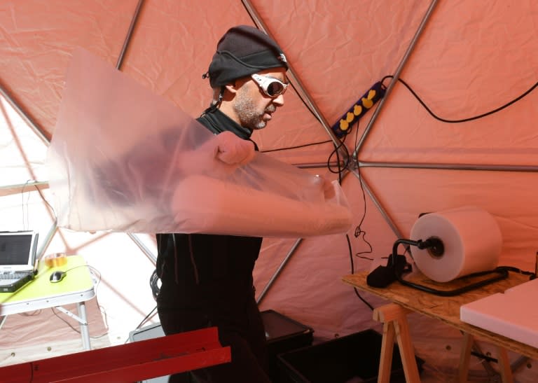 ICE Memory expedition coordinator Patrick Ginot wraps a sample collected on the project's first expedition on Mont Blanc