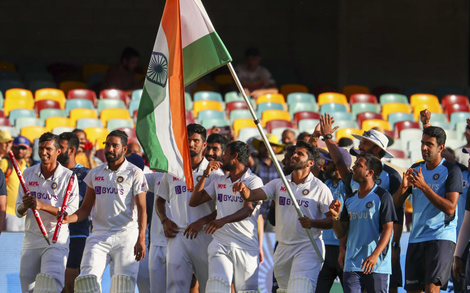 Indian players celebrate after defeating Australia by three wickets on the final day of the fourth cricket test at the Gabba, Brisbane, Australia, Tuesday, Jan. 19, 2021.India won the four test series 2-1. (AP Photo/Tertius Pickard)