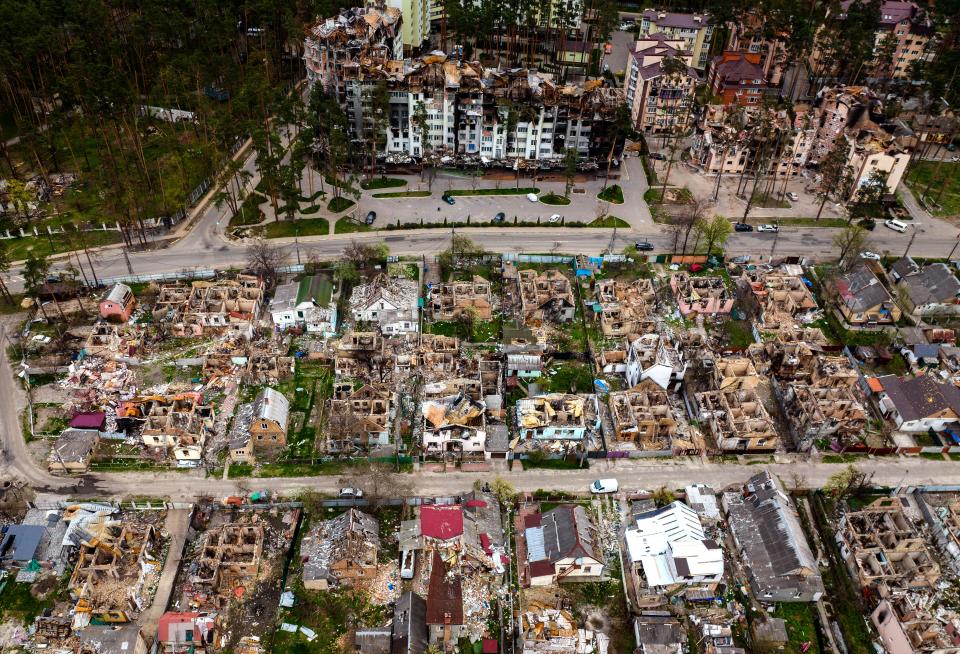 Destroyed houses are photographed in Irpin, on the outskirts of Kyiv, Ukraine, Saturday, April 30, 2022.