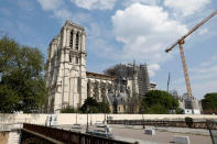 A view shows the Notre-Dame de Paris Cathedral, which was damaged in a devastating fire one year ago, as the coronavirus disease (COVID-19) lockdown slows down its restoration in Paris, France, April 11, 2020. (REUTERS/Charles Platiau)