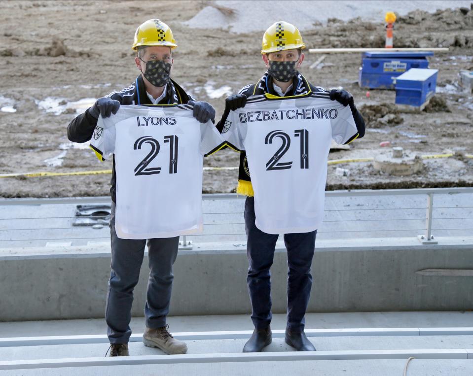 Tim Bezbatchenko, Crew SC President & General Manager, and Steve Lyons, Crew SC Executive Vice President Chief Business Officer, pose with jerseys as Columbus Crew SC unveiled its primary kit for the 2021 season at an event held at the New Crew Stadium.