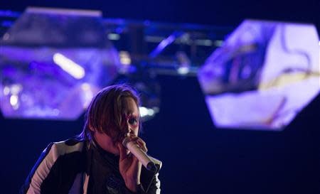 Lead vocalist Win Butler of rock band Arcade Fire performs at the Coachella Valley Music and Arts Festival in Indio, California April 13, 2014. REUTERS/Mario Anzuoni