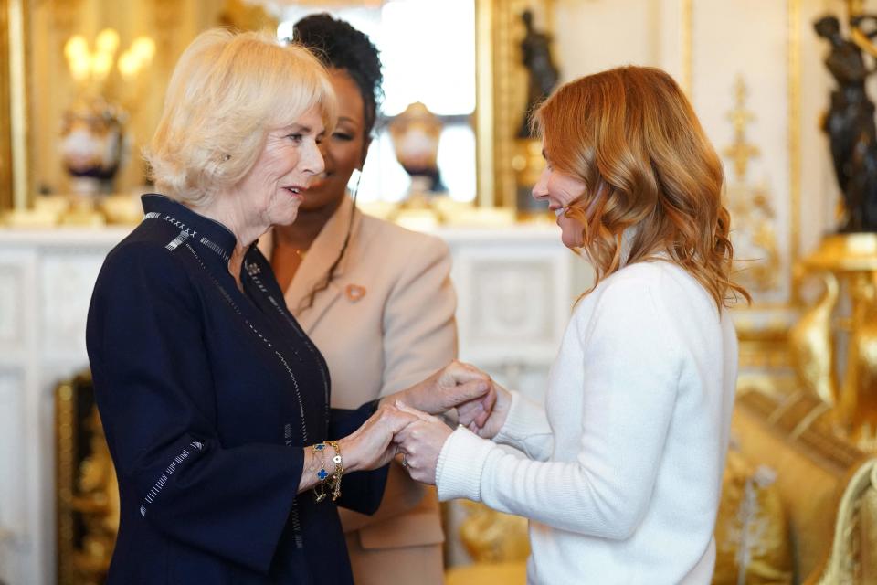 Geri Halliwell-Horner, also known as Ginger Spice of '90s pop sensations The Spice Girls, greets Queen Consort Camilla during a reception for winners of the Queen's Commonwealth Essay Competition at Buckingham Palace, on Nov. 17, 2022. Horner, a Royal Commonwealth Ambassador, helped read extracts from the winning essays during the reception.