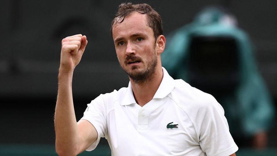 Daniil Medvedev raises his right fist in celebration