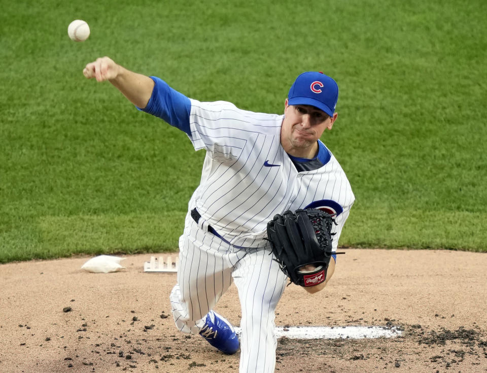 FILE - Chicago Cubs starting pitcher Kyle Hendricks delivers during the first inning of a baseball game against the San Francisco Giants, Sept. 5, 2023, in Chicago. Hendricks' $16 million option for 2024 was exercised Sunday, Nov. 5, 2023, by the Cubs, who also exercised a $6 million option on catcher Yan Gomes. (AP Photo/Charles Rex Arbogast, File)