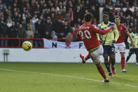 Nottingham Forest's Brennan Johnson scores his side's opening goal during the English Premier League soccer match between Nottingham Forest and Leeds United at City Ground stadium in Nottingham, England, Sunday, Feb. 5, 2023. (AP Photo/Rui Vieira)