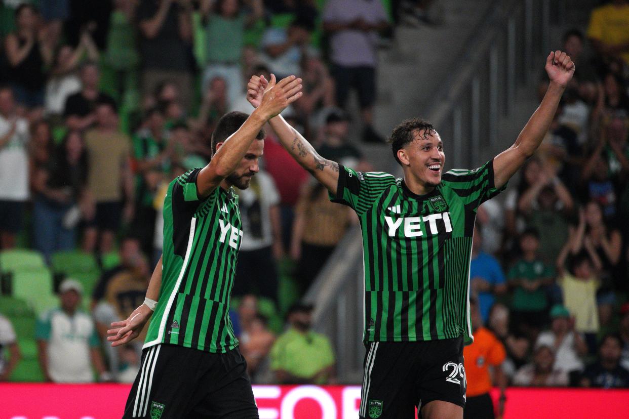 July 26, 2024;  Austin, Texas, USA;  Austin FC defender Brendan Hines-Ike (4) and defender Guilherme Biro (29) celebrate a 3-2 win against Pumas UNAM at Q2 Stadium.  Mandatory Credit: Dustin Safranek-USA TODAY Sports