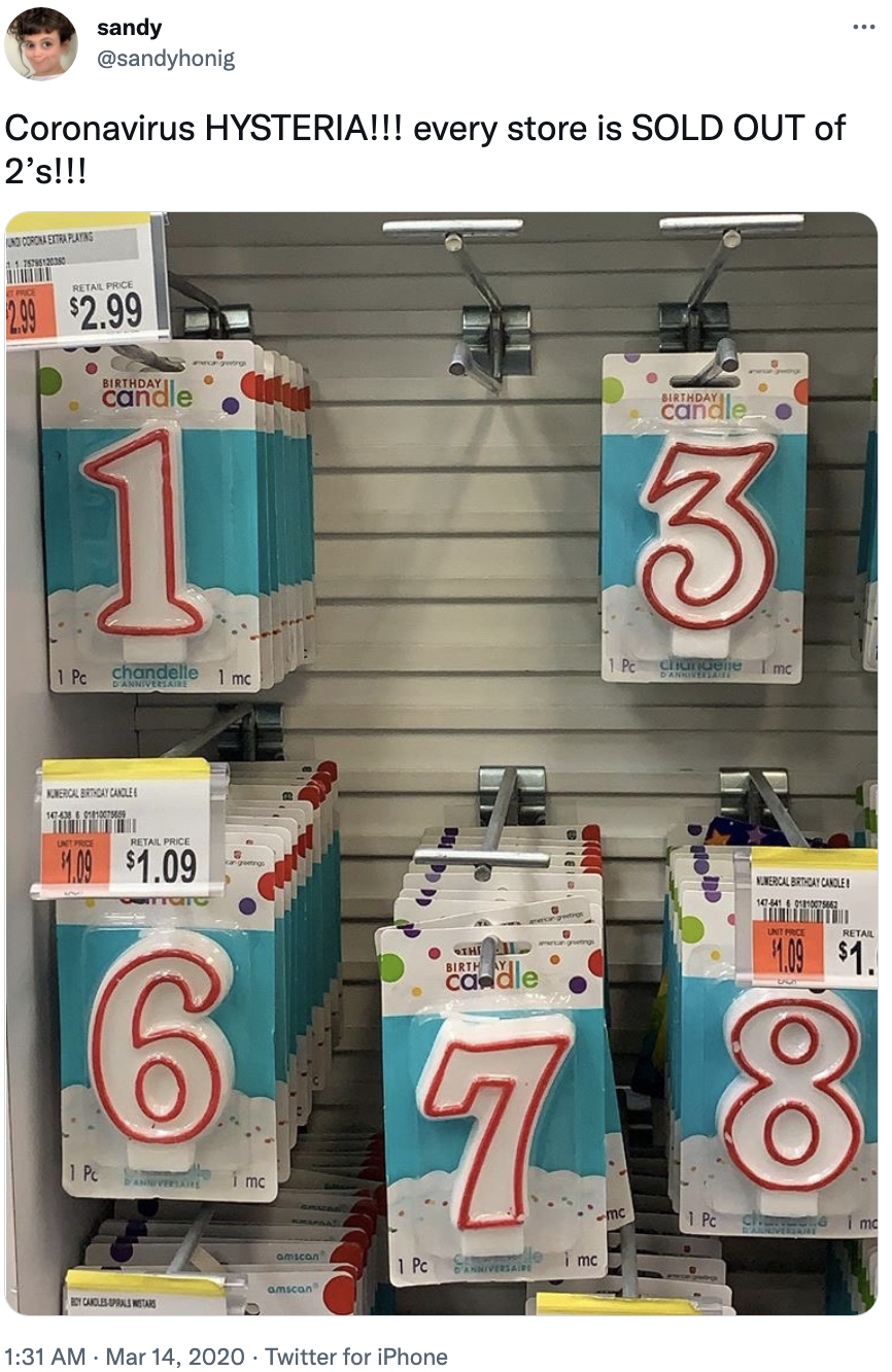 coronavirus hysteria, every store is sold out of 2's and a photo showing numeral candles with the 2 section empty