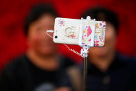 <p>People take pictures of themselves in Tiananmen Square as they celebrate National Day marking the 67th anniversary of the founding of the People’s Republic of China, in Beijing October 1, 2016. (REUTERS/Damir Sagolj) </p>