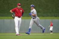 Kansas City Royals' Vinnie Pasquantino runs the bases, passing Minnesota Twins third baseman Gio Urshela after hitting a two-run home run during the first inning of a baseball game Monday, Aug. 15, 2022, in Minneapolis. (AP Photo/Abbie Parr)