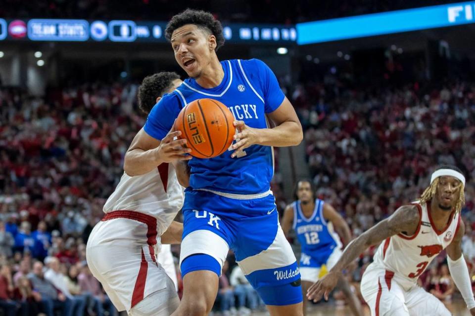 Kentucky forward Tre Mitchell (4) grabs a loose ball during Saturday’s game against Arkansas. He’s averaging 13.4 points, 7.7 rebounds and 3.3 assists this season.