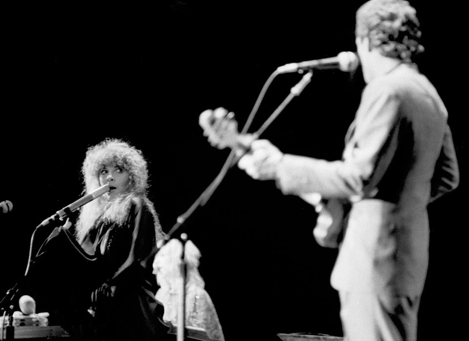 <p>The band continued to perform together, though Nicks and Buckingham's relationship was tumultuous.</p> <p>While on tour for <em>Rumours, </em>the pair fought on stage. The band recounted the event <a href="https://www.rollingstone.com/music/music-news/fleetwood-mac-back-on-the-chain-gang-243176/" rel="nofollow noopener" target="_blank" data-ylk="slk:Rolling Stone, 20 years later;elm:context_link;itc:0;sec:content-canvas" class="link "><em>Rolling Stone, </em>20 years later</a>. Christine McVie told the publication, "I think [Buckingham]'s the only person I ever, ever slapped. I actually might have chucked a glass of wine, too. I just didn't think it was the way to treat a paying audience. I mean, aside from making a mockery of Stevie like that. Really unprofessional, over the top. Yes, [Nicks] cried. She cried a lot."</p> <p>Trouble with the band continued as Fleetwood and Nicks started — and quickly ended — an affair while on tour. </p>