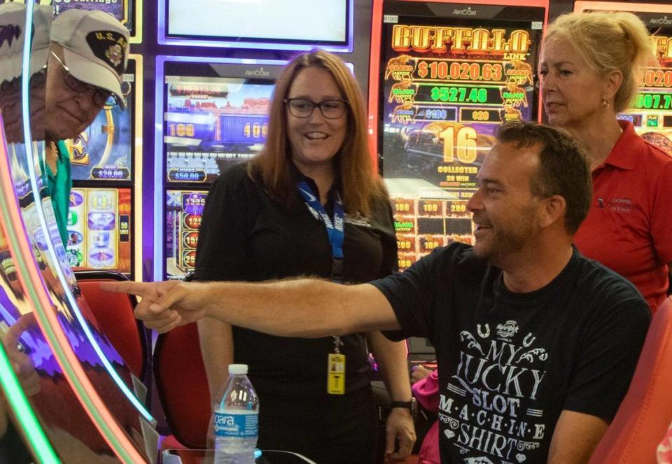 Jason Brewer hits one of the first jackpots on opening day of the temporary gaming facility at Catawba Two Kings Casino in Kings Mountain, NC, on Thursday, July 1, 2021.