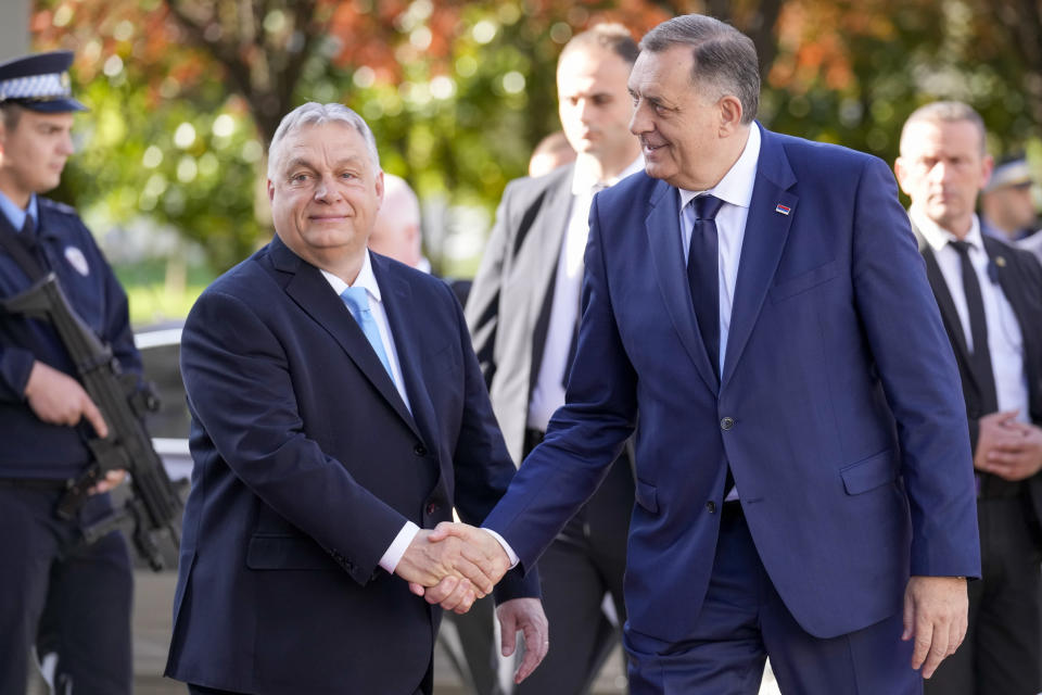 Bosnian Serb leader Milorad Dodik, right, welcomes Hungary's Prime Minister Viktor Orban, in Banja Luka, Bosnia, Friday, April 5, 2024. (AP Photo/Darko Bandic)