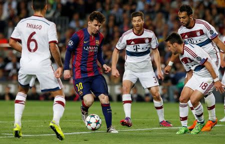 FC Barcelona v Bayern Munich - UEFA Champions League Semi Final First Leg - The Nou Camp, Barcelona, Spain - 6/5/15 Barcelona's Lionel Messi in action with Bayern Munich's Thiago, Xabi Alonso, Juan Bernat and Mehdi Benatia Reuters / Gustau Nacarino