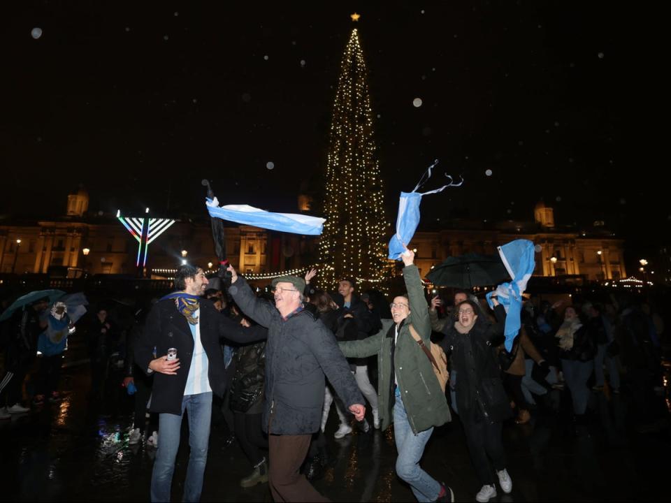 18 December 2022: Argentina fans celebrate at Trafalgar Square in London after their side won the World Cup (PA)