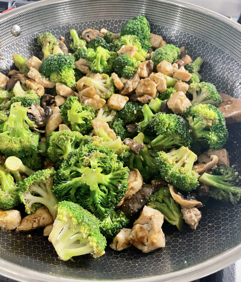 A bowl of chicken and broccoli